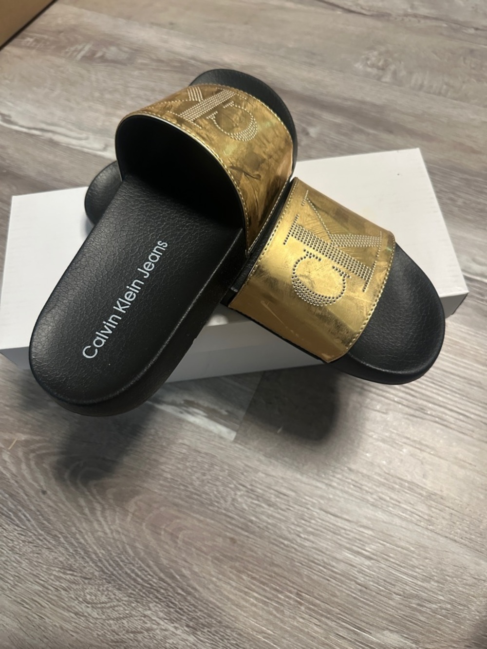 Calvin Klein Jeans Black Footbed with Gold Metallic Strap Slides NEW